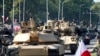 ລົດ​ຖັງ Abrams ທີ່​ຜະ​ລິດ​ໃນ ສະ​ຫະ​ລັດ ເຊິ່ງ​ ໂປ​ແລນ ໄດ້​ຊື້, ເຂົ້າ​ຮ່ວມ​ໃນ​ການ​ເດີນ​ສວນ​ສະ​ໜາມກອ​ງ​ທັບ​ໃນ​ນະ​ຄອນຫຼວງ ວໍ​ຊໍ, ໂປ​ແລນ, 25 ສິງ​ຫາ 2023.