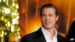 Brad Pitt pose à la première du film "Babylon", le 15 décembre 2022, à l'Academy Museum of Motion Pictures de Los Angeles. (AP Photo/Chris Pizzello)