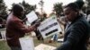 Presiding officers check electoral material at the tallying center in Kilgoris, Kenya, Aug. 8, 2022.