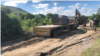 ARCHIVES - Des machines minières lourdes sur la route dans le district de Mutoko au Zimbabwe, le 1er février 2022.