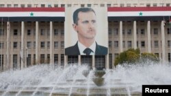 Foto do Presidente Bashar al-Assad na sede do banco central, Damasco