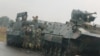 FILE: Soldiers stand beside military vehicles just outside Harare, Zimbabwe, Nov. 14,2017.