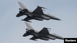 Polish Air Force F-16 fighter jets fly in formation during the Clear Sky 2018 multinational military..