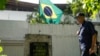 Venezuelan government opponents decry police outside embassy