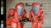 FILE - Tokyo Fire Department special rescue unit members wearing anti-NBC (Nuclear, Biological, and Chemical weapons) suits participate in an anti-terrorism drill in Japan, May 11, 2016.