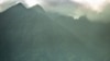 FILE - An afternoon shower rolls in over the volcanic mountains of Virunga National Park, home to a famous gorilla reserve, Sept. 23, 1997. The Democratic Republic of Congo is planning to sell land blocks that extend into the park to use for oil and gas exploration.