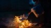 An election official burns ballots after the counting has finished at a voting station in Libreville on November 16, 2024. Gabon on Saturday held a referendum on a new constitution after a coup ended 55 years of rule by the Bongo dynasty in the oil-rich nation. 