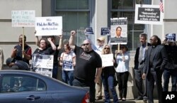 Opponents of House Bill 2 protest across the street from the North Carolina State Capitol in Raleigh, North Carolina, April 11, 2016.