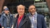 被控非法充當中國政府代理人的波士頓男子梁利堂(Litang Liang，音譯)2025年2月10日在被判無罪後和其辯護律師合影。