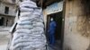 A medic stands behind sandbags in the damaged al-Hakeem hospital, in the rebel-held besieged area of Aleppo, Syria, Nov. 19, 2016. Top U.N. officials warned Monday, Nov. 21, 2016, that health care services in Syria have been devastated by bombings.