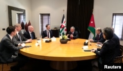 Jordan's King Abdullah meets with Senior White House Advisor Jared Kushner, center, in Amman, Jordan, May 29, 2019.