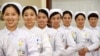 Nurses practice smiling with chopsticks in their mouths at a hospital in Handan, Hebei province, China, May 8, 2017. 