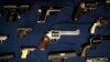 FILE - Guns seized by the police are displayed during a news conference in New York.