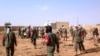 Soldiers attend to wounded and casualties in the aftermath of a suicide bomb attack who ripped through a camp grouping former rebels and pro-government militia in troubled northern Mali Jan. 18, 2017 in Gao. 