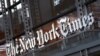 FILE - In this Thursday, May 6, 2021, photo, a sign for The New York Times hangs above the entrance to its building, in New York.